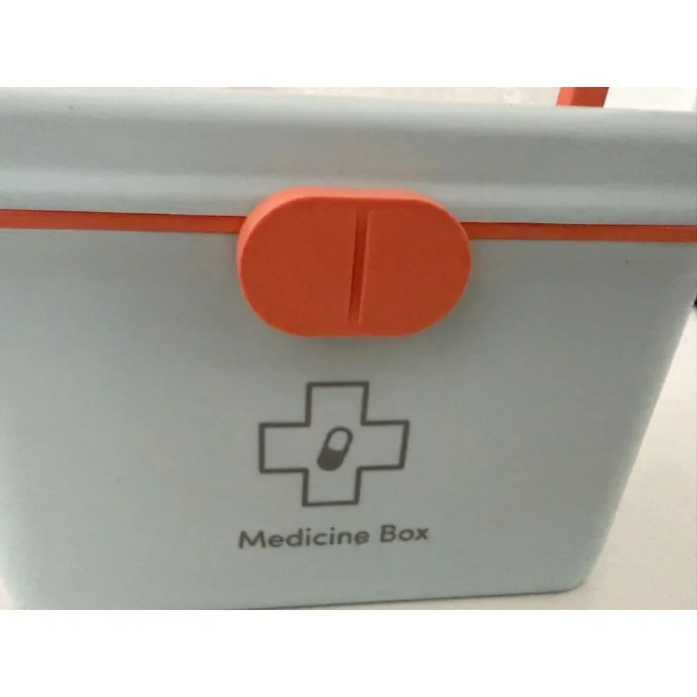 Modern portable plastic medicine box with orange handle and latch